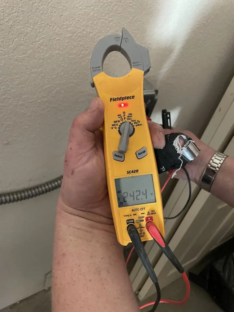 Voltage testing with clamp meter during Outlet Installation in Oregon